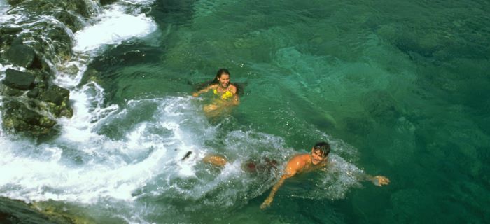 Couple swimming in the Natural Pool