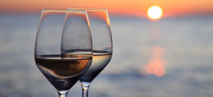 drinking wine at sunset