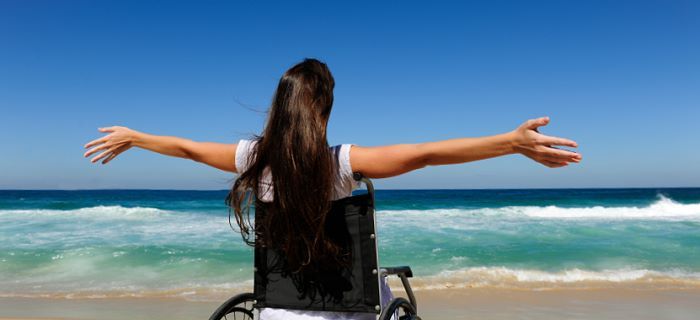 with a wheelchair on the beach