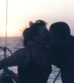 Kissing Honeymooners Mark & Diana
